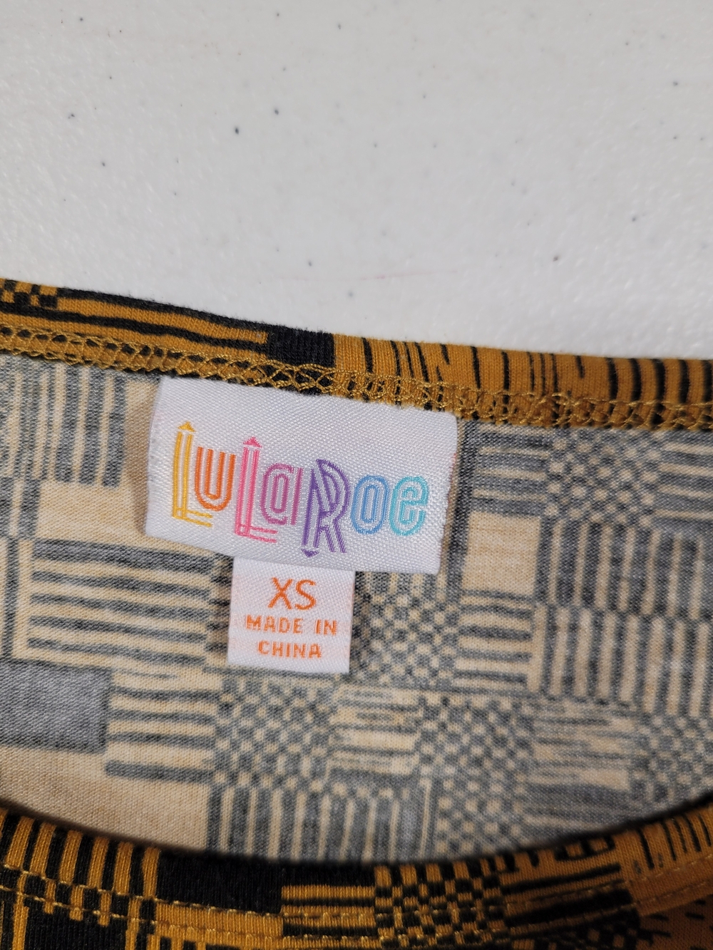 LuLaRoe Yellow and Black Geometric Short Sleeve Tee - Picture 2 of 3